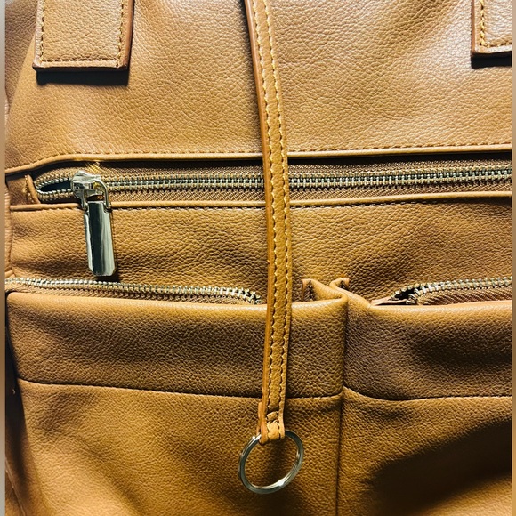 Brown patent leather diaper bag with multiple pockets and key holders - Picture 10 of 12